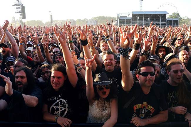 crowd at a concert, hands in air